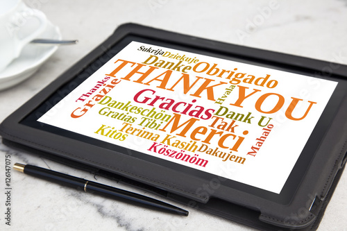 tablet with thank you word cloud