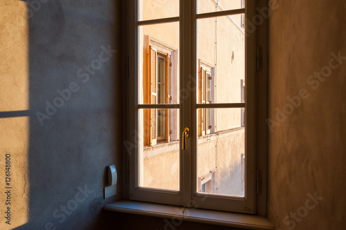 Windows forming shapes with sunlight and shadows