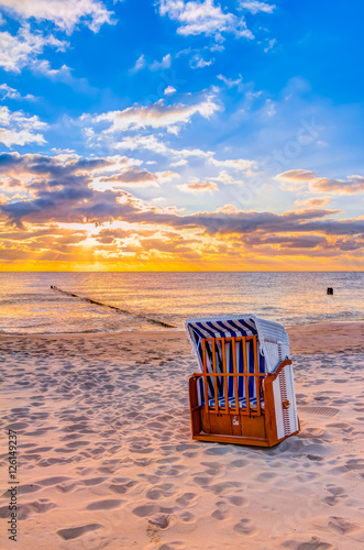Wonderful morning sun at the beach in summer with beach chair