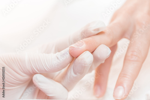 woman in a beauty salon receiving  manicure © producer