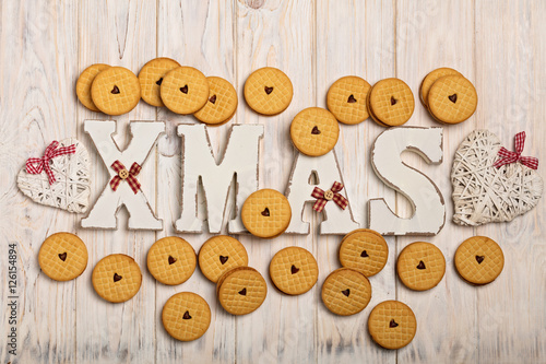 Merry Christmas! Cookies with jam hearts and wooden letters XMAS