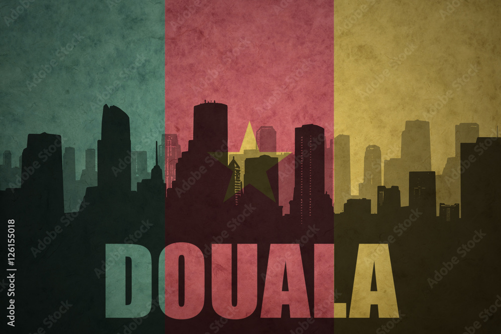 abstract silhouette of the city with text Douala at the vintage cameroon flag