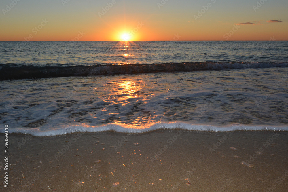 sunset on the sea beach in calm weather