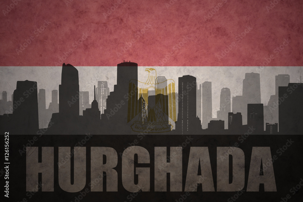 abstract silhouette of the city with text Hurghada at the vintage egyptian flag