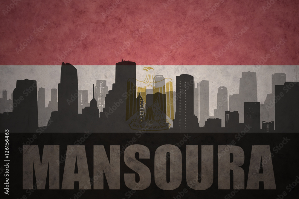 abstract silhouette of the city with text Mansoura at the vintage egyptian flag