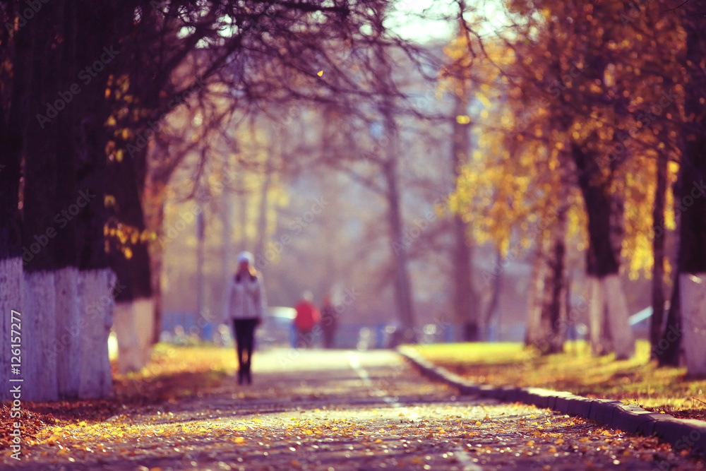 blurred background path in autumn city park blurred background path in autumn city park