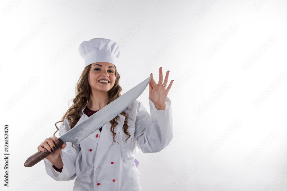 Girl chef with a large knife on a white background Girl chef with a large knife on a white background