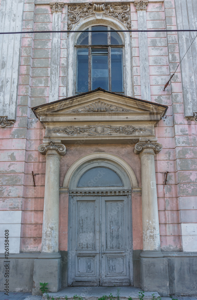 door of beautiful old large house. Columns, windows, moldings