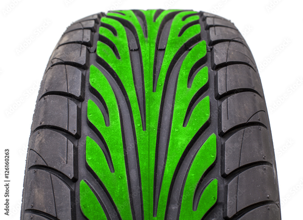 Wet weather tire with green color tread in the middle of contact area