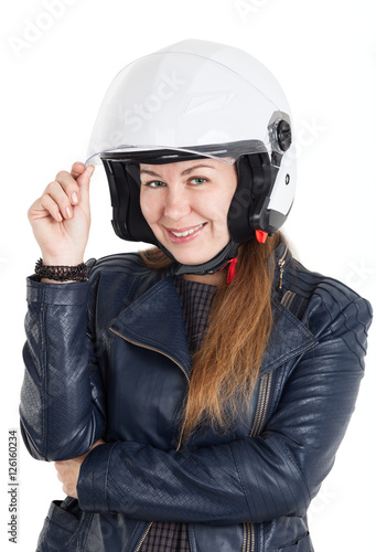Cheerful woman in leather jacket and white motorcycle helmet with opened visor, isolated on white background