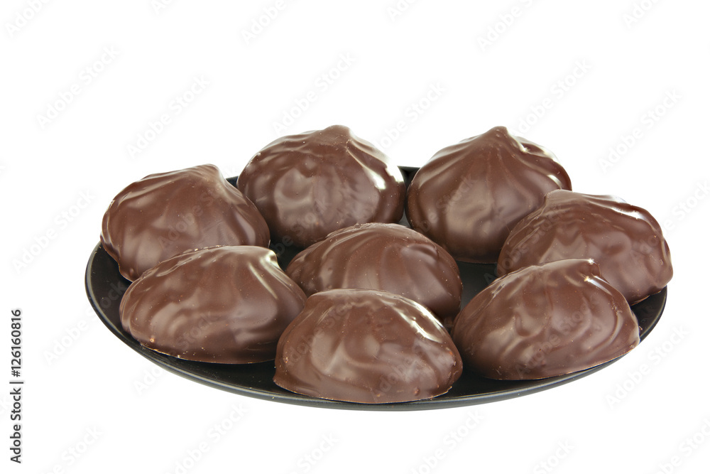 Delicious chocolate marshmallow on plate on white Delicious chocolate marshmallow on plate on white