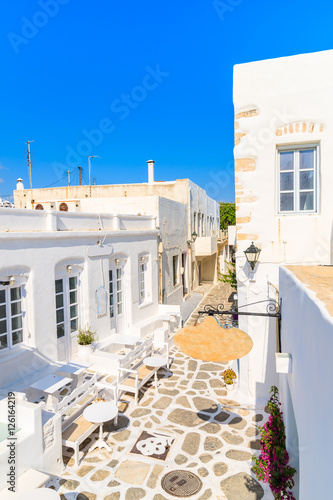 Beautiful Greek style architecture of cafe and drink bar on street of Naoussa village, Paros island, Cyclades, Greece