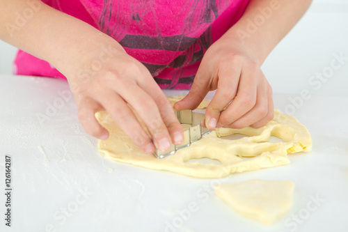 Cutting shapes out of dough