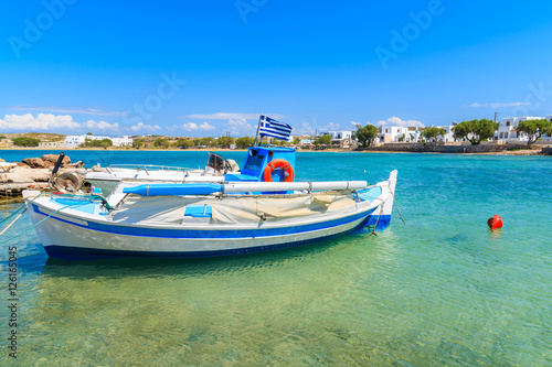 Fishing boat in small sea bay in Naoussa town, Paros island, Greece