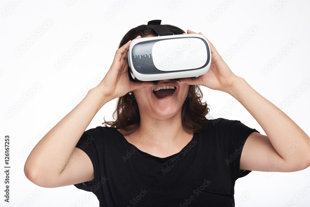 Surprised woman watching virtual reality Surprised woman watching virtual reality