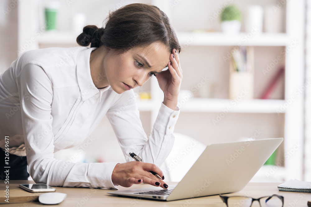 Attractive female using laptop Attractive female using laptop