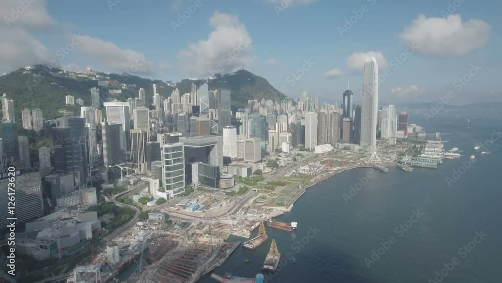 Aerial drone flight towards the iconic modern skyline of Hong Kong