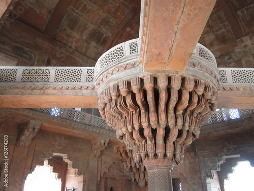 Stone stalactite chandelier carving  in harem palace of red sandstone, Fatepuhr Sikri, Agra,India photo