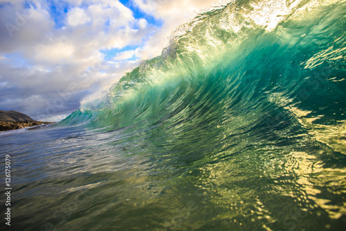 Fototapeta Naklejka Na Ścianę i Meble -  Shining Translucent Ocean Background Shorebreak Wave for Surfing