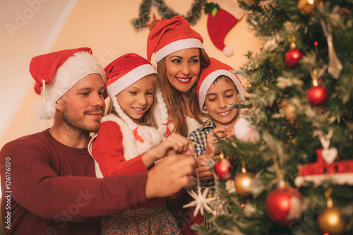 Family Decorating Christmas Tree