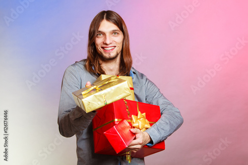 Guy with many presents gift boxes