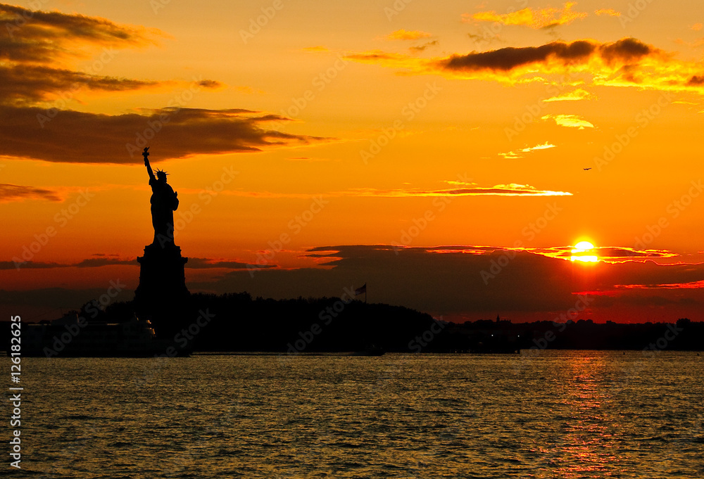 Statue of Liberty against sunset - saturated silhouette