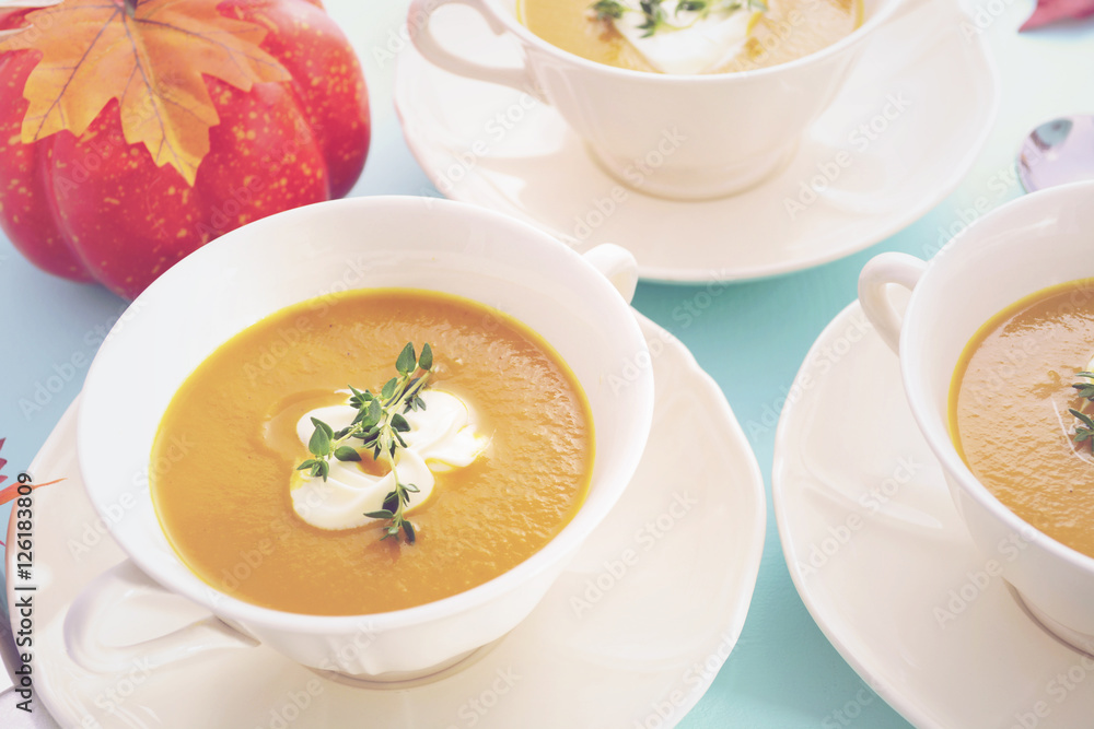Thanksgiving table setting with pumpkin soup. Thanksgiving table setting with pumpkin soup.
