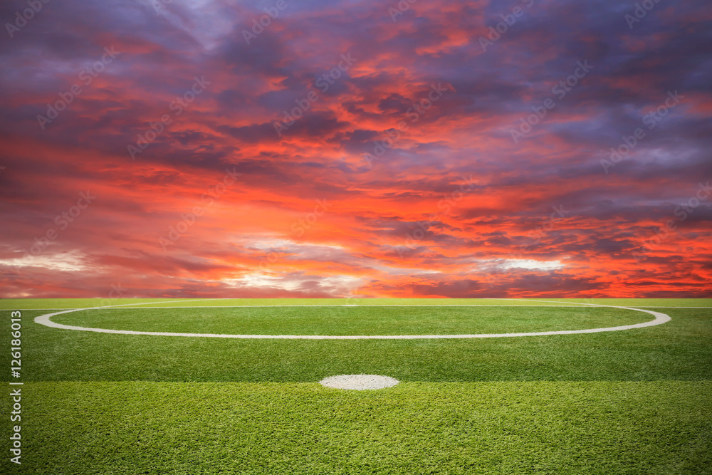 Artificial turf soccer field and sunset