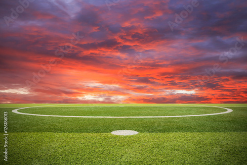 Artificial turf soccer field and sunset