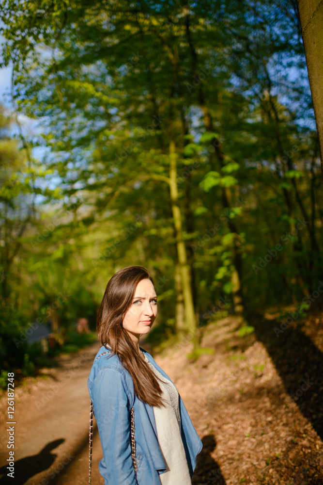 Young girl on a walk in the forest