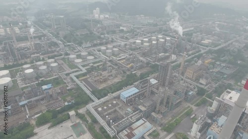 Aerial overview of an oil refinery, heavy industry and polluting smokestacks in Guangzhou, China photo