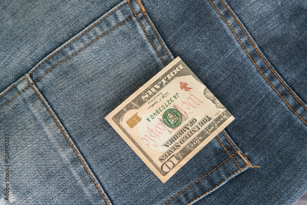 Ten American dollars bill sticking out of the blue jeans pocket,Pocket in old jeans jacket with ten US dollar,Business concept exchange Ten American dollars bill sticking out of the blue jeans pocket,Pocket in old jeans jacket with ten US dollar,Business concept exchange