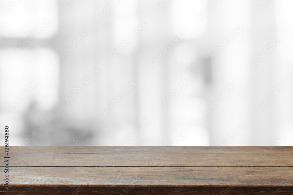 Wood table top and blurred abstract background from interior building - can used for display or montage your products.
