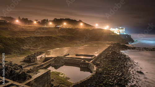 Photography Sutro Baths Ruins with a Distant House in San Francisco at Night