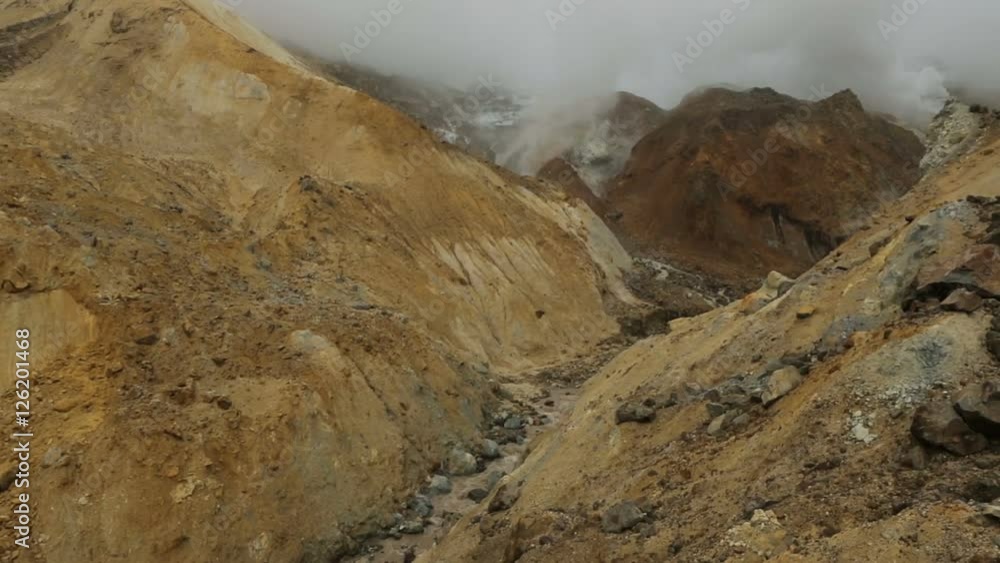 Stream from the melting of glaciers on active volcano Mutnovsky stock footage video