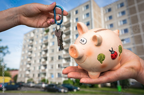 Real estate agent giving flat keys to a new property owner