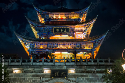 DALI, YUNNAN PROVINCE, CHINA - OCTOBER 15, 2016 : Wuhua House at night as the landmark of Dali Town in Yunnan Province, CHINA photo