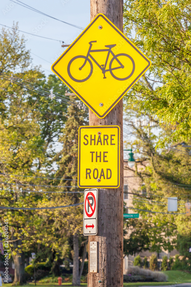 Bicycle lane sign on side walk for road safe warning.