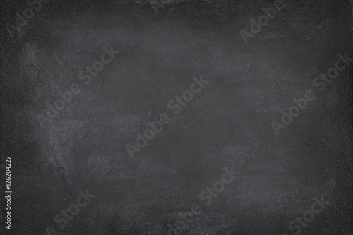 Black Chalkboard blackboard chalk texture background. Black chalk board texture empty blank with writing chalk traces erased on the board. Copyspace for text advertisement. School board display.