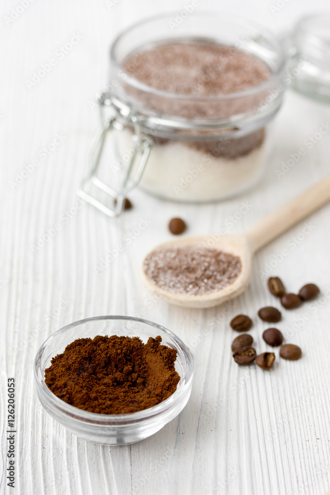 Homemade body peeling cocoa-sugar on wooden background close up Homemade body peeling cocoa-sugar on wooden background close up