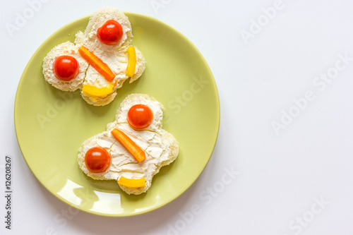 kid breakfast butterfly sandwiches top view on white background