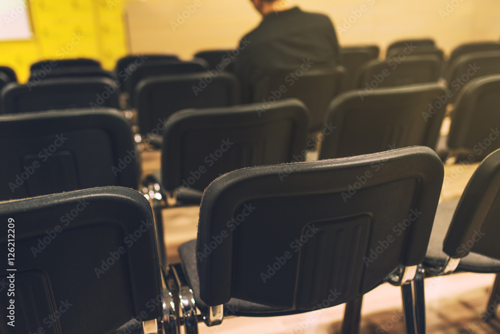 Unrecognizable journalist in press conference room Unrecognizable journalist in press conference room