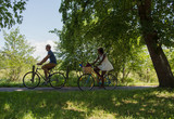 Young  couple having joyful bike ride in nature