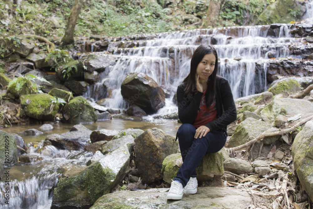 Thai woman with Mae Kam Pong waterfall, Chiangmai Thailand Thai woman with Mae Kam Pong waterfall, Chiangmai Thailand