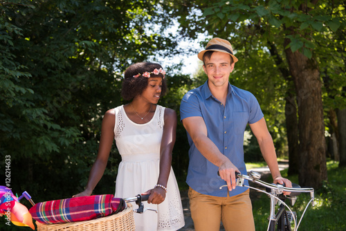 Wallpaper Mural Young  couple having joyful bike ride in nature Torontodigital.ca