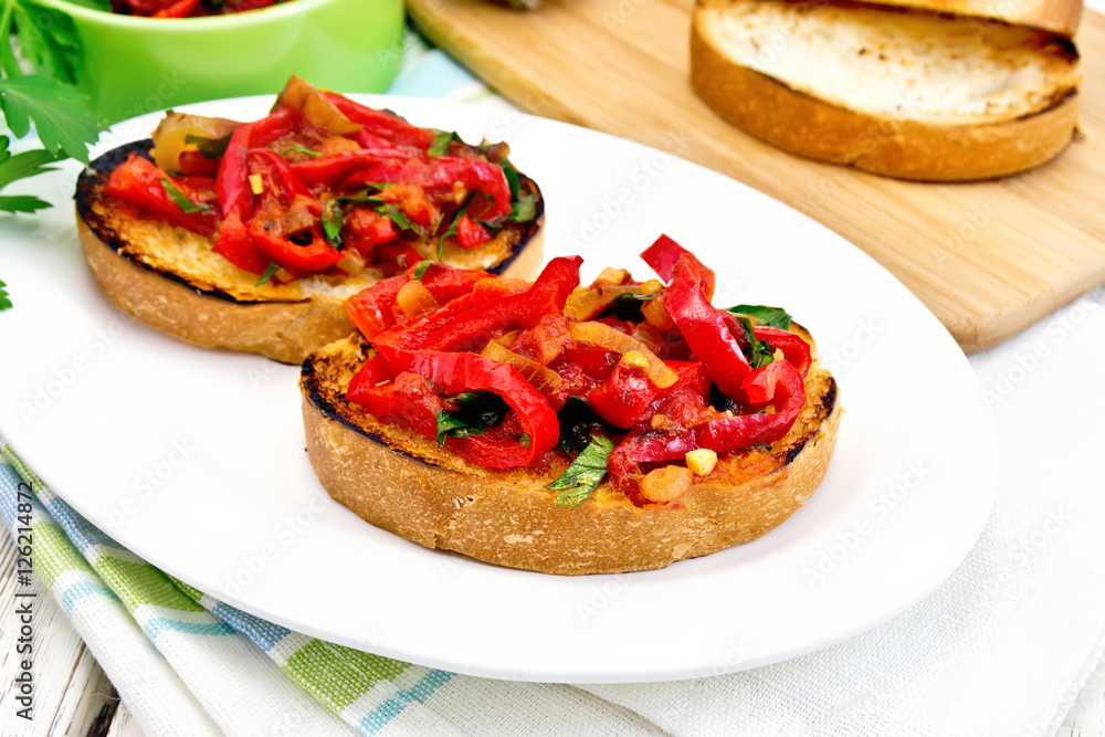 Bruschetta with tomatoes and peppers in plate on board Bruschetta with tomatoes and peppers in plate on board