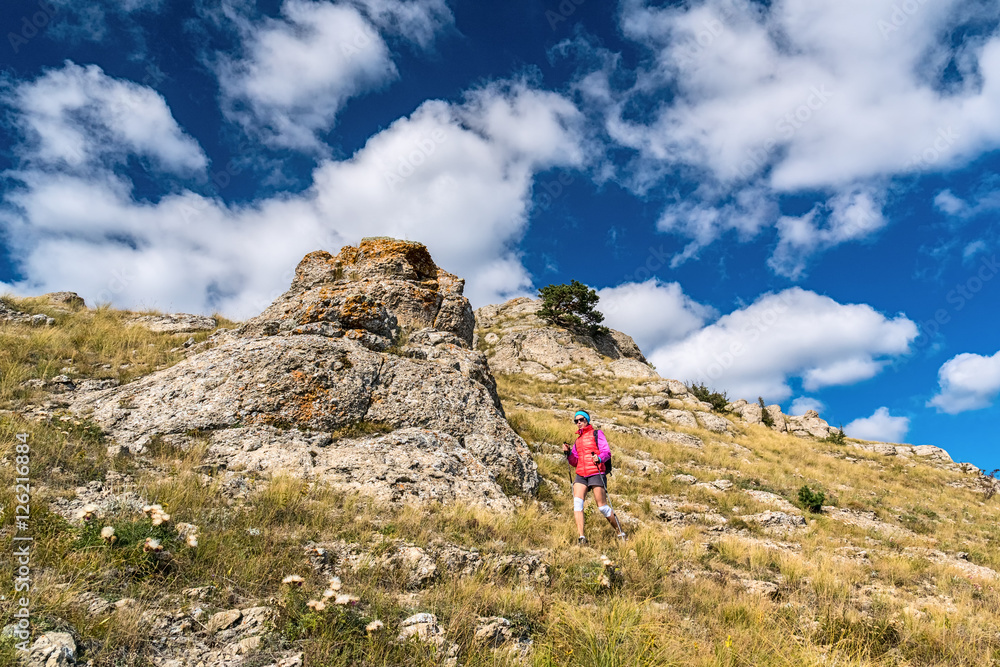 Girl tourist goes on mountainside of Demerdzhi