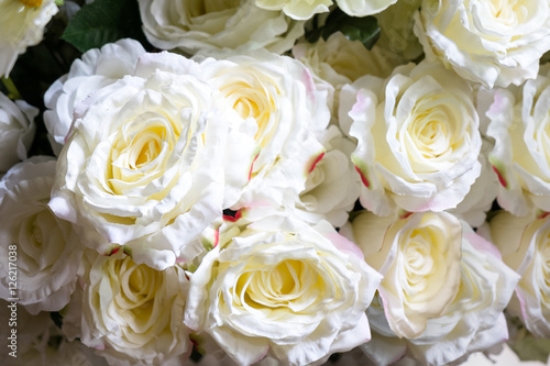 Artificial flowers  Artificial white roses background.