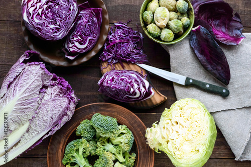 Many kinds of cabbage - red, broccoli, Brussels sprouts, white, napa cabbage. Ingredients for the preparation of vegetable dishes. The top view.