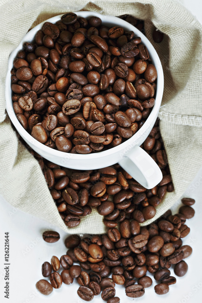 Fototapeta premium White cup with coffee in bag
